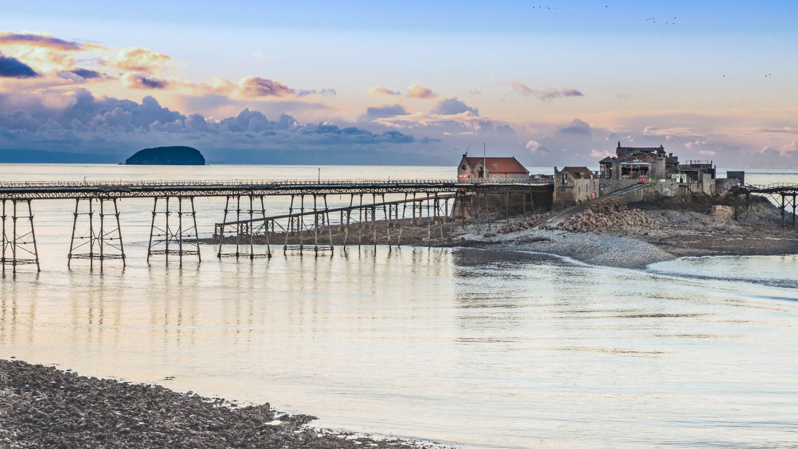 A view of Weston's dilapidated Birnbeck Pier at sunset